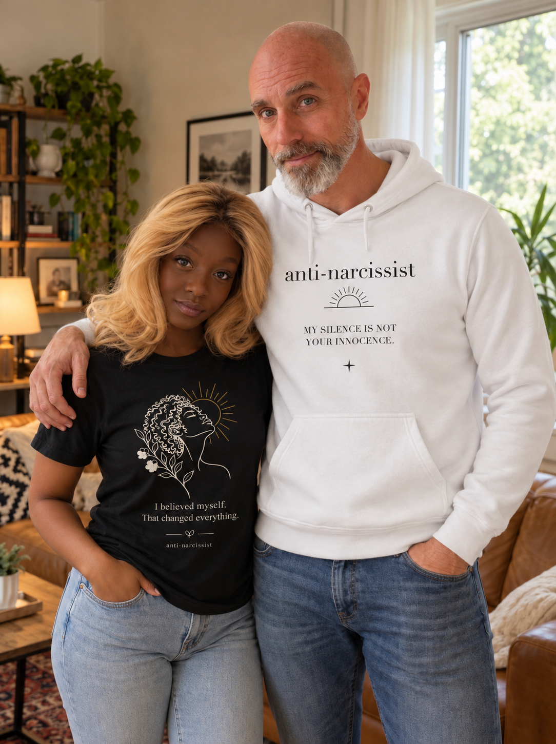 White My Silence premium hoodie and black I Believed Myself tee worn together.